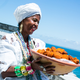 Baianas de Acarajae traditionally dressed in white to sell acarajae—an Afro-Brazilian snack food. (Ministry of Culture of Brazil)